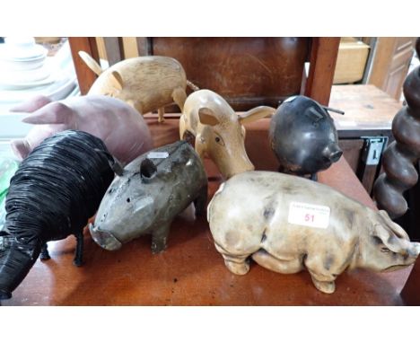 A COLLECTION OF CERAMIC, WOODEN AND METAL PIGS