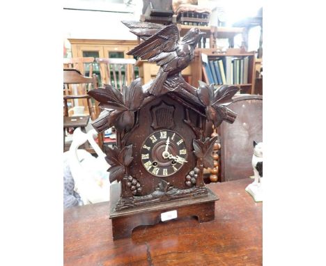 A BLACK FOREST CUCKOO MANTEL CLOCK, 44cm high (working)