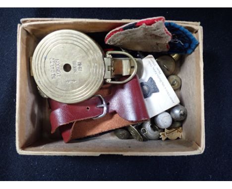 T. G. CO. LTD. LONDON COMPASS, in a brass case, dated "1941" to include a collection of buttons and badges