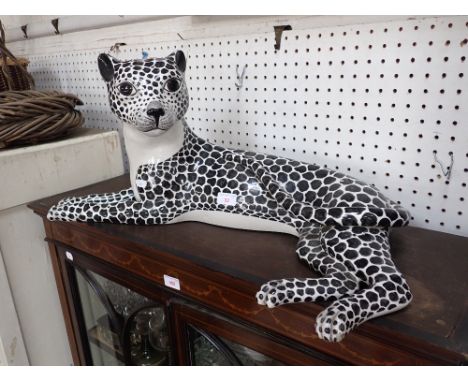 A LARGE CERAMIC STUDY OF A LEOPARD, 73cm long