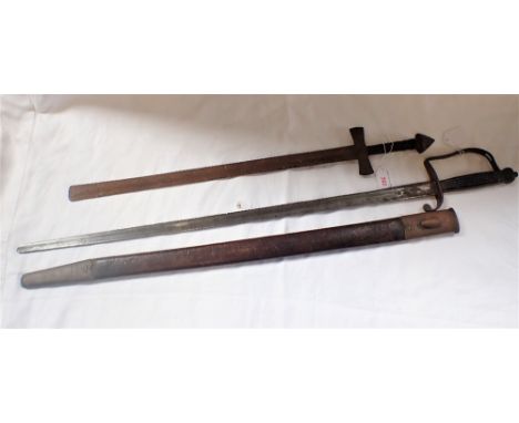 AN ARCHAIC STEEL SWORD with engraved decoration to the handle and a sword with a leather scabbard (2)