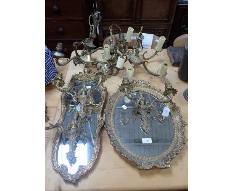 TWO GILT FRAMED WALL MIRRORS and a collection of gilt metal lighting