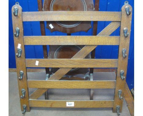 Oak hat or whip rack in the form of a five bar gate with oxidised brass hooks. (B.P. 24% incl. VAT)30