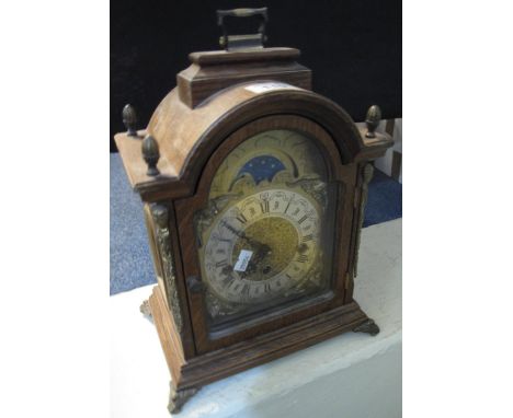 Franz Hermle German movement oak three train bracket clock with gilt mounts, silvered face and standing on metal feet. (B.P. 