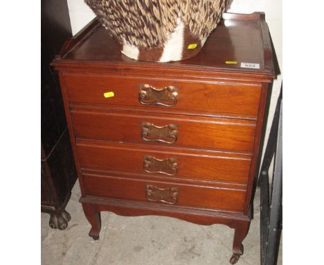 Edwardian mahogany four drawer music cabinet on ceramic casters. (B.P. 24% incl. VAT)