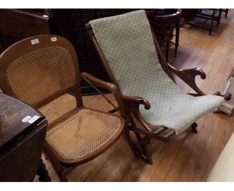 A campaign armchair, with cane back and seat, and a similar folding rocking chair (2) Condition report Report by RB

Campaign