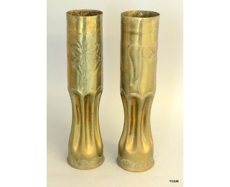 An impressive pair of WW1 trench art shell case fluted vases decorated with flowers. 8.5cms diameter by 35cms high