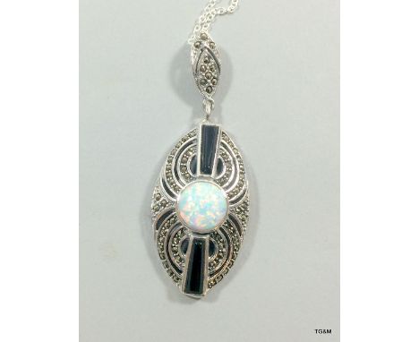 A Silver Onyx And Large Central Opal Pendant On Silver Chain