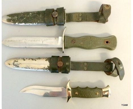 A German Bundeswehr knife in its metal scabbard with leather frog. Marked HSK 70 to the blade and BW to the hilt. With a shea