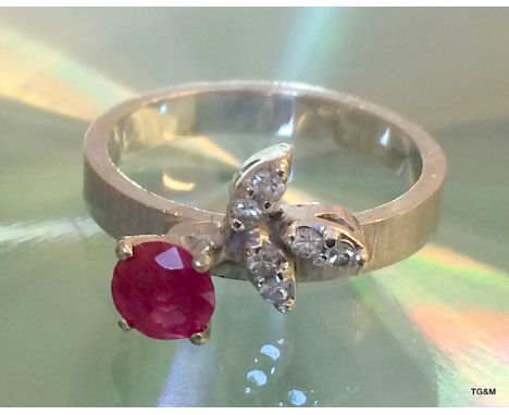A 14Ct W/G Ruby And Diamond Ring