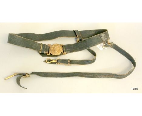 An early 20th century Royal Navy officers black leather sword belt with hanging straps and gilt buckle