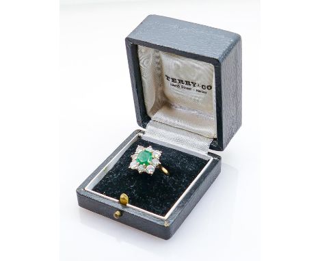 18ct yellow gold Emerald &amp; Diamond dress ring: A nice coloured emerald measuring 7.5mm x 7.5mm appx., surrounded by 8 x .