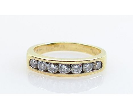 Modern seven diamond ring set in 18ct: Not hallmarked but inner shank marked dia .80 indicating total diamond weight is 80 po