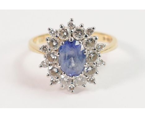 18ct gold sapphire and diamond cluster ring: Pale blue oval sapphire approx. 1.2ct, ring size M, 4.1g. Insurance valuation fr