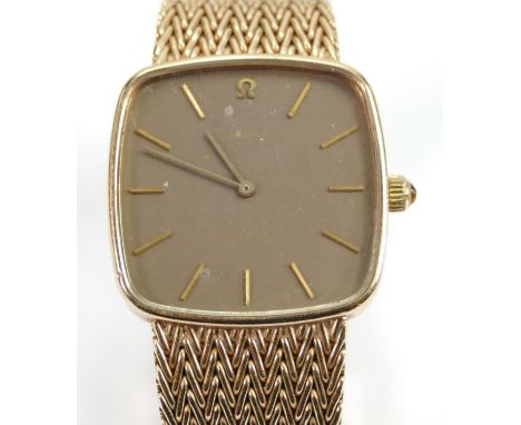Omega de Ville 9ct gents watch and 9ct bracelet: Winds, ticks, runs down and hands set.  Gross weight 63.7g, case diameter 29