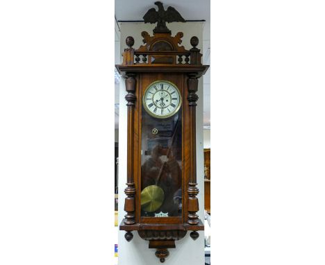 Early 20th century Vienna walnut double weight wall clock: With two brass weights and eagle pediment, h.120 (without eagle) x