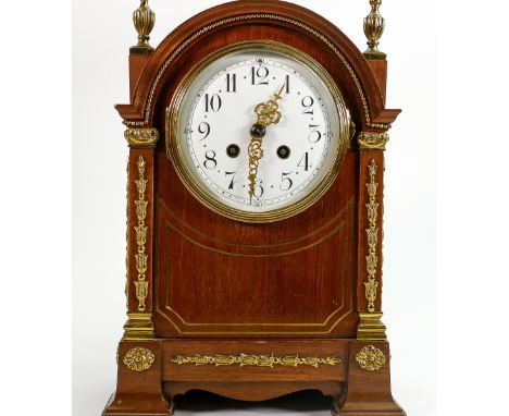 Mahogany French Mantle clock with brass mounts: Standing 33cm high.  A nice quality mahogany cased Empire style clock in tick