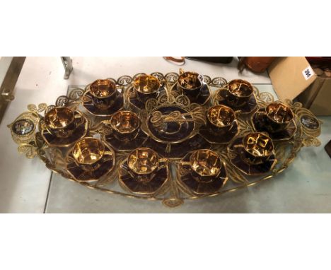 GILT METAL FILIGREE OVAL TRAY CONTAINING BLEU DE ROI AND GILDED TEACUPS AND SAUCERS