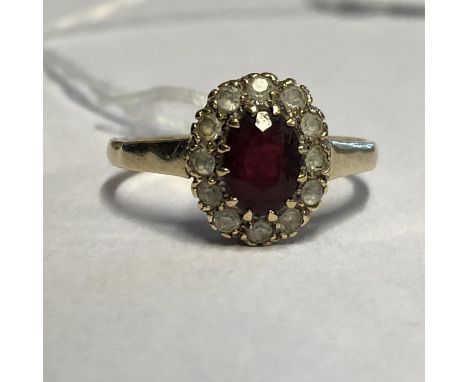 9CT RUBY AND CZ CLUSTER RING SIZE O/P 2.3G APPROX