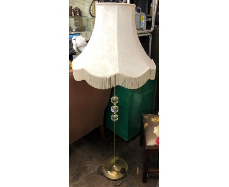 BRASS AND GLASS THREE BALL LAMP STANDARD AND FRINGED SHADE