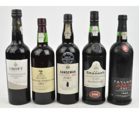 Port ; eight bottles ; 1986 Sandeman, 1977 Sandeman vintage, 1983 Grahams vintage (x2), Croft 'Extravagance',  1991 Quinta de