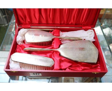 Cased Silver Dressing table set of 2 brushes, Comb and a Silver backed brush with engraved Deco design