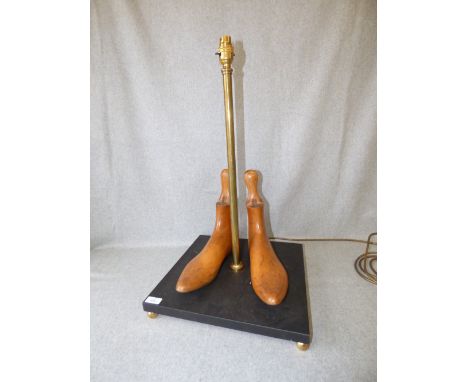 Decorative table lamp in form of pair of boot trees