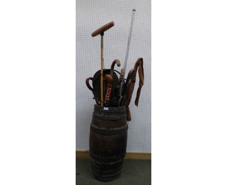 Oak & metal bound barrel stick stand with shooting sticks, polo sticks etc.