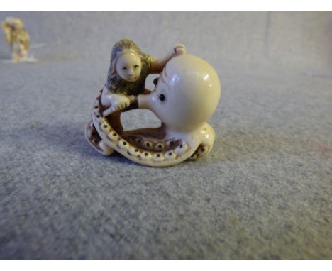 Chinese carved ivory netsuke of figure & octopus