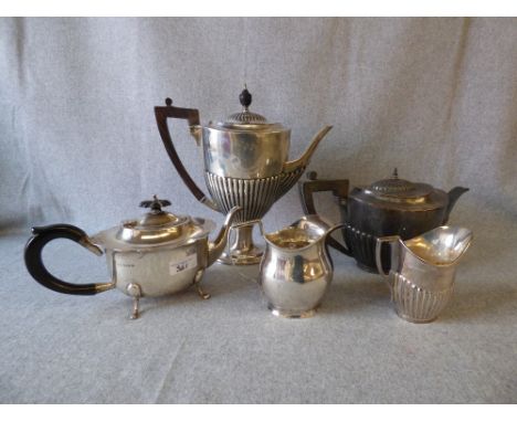 Late Victorian silver pedestal coffee pot by William Hutton & Sons Ltd, London 1900, with two other silver teapots, an Edward