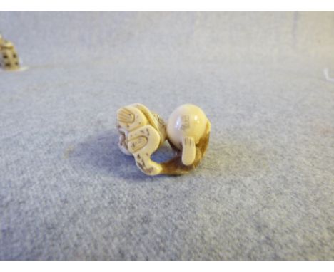 Chinese carved ivory netsuke of tradesmen and monkey