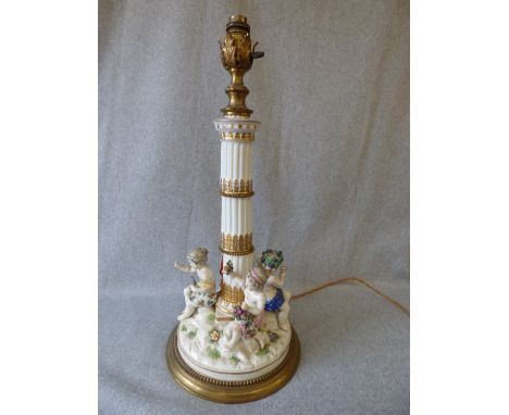 Late C19th Meissen style Candlestick/lamp base with gilt metal mounts, the fluted column above a base with four cherubs emble