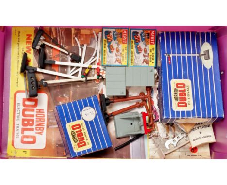 A box of Hornby Dublo and Merit accessories, including electric light and semaphore signals, loading gauges, water cranes, a 
