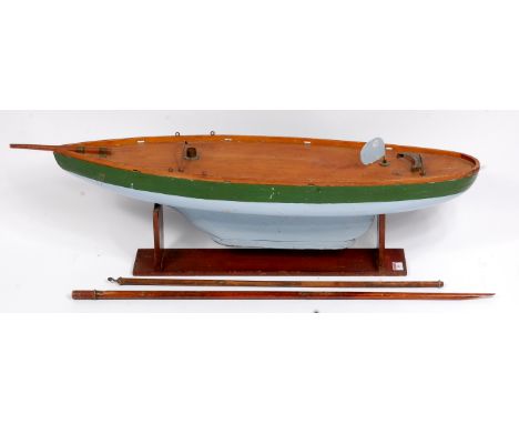 An early 20th century Pond Yacht Hull, constructed from wooden, and painted in green and light blue, with stained decking, Ma
