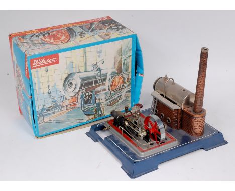 Wilesco D16 Steam Engine Plant, comprising of tin base housing a horizontal boiler with burner, whistle and detailed brick wo