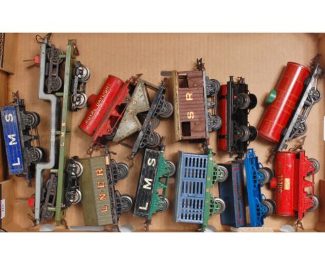 Large tray of 13 prewar Hornby wagons including NE bogie trolley wagon, LMS No. 2 timber wagon, LNER cement, LMS Milk Traffic