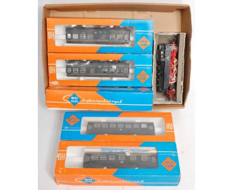 A Fleischmann DB BR64 2-6-2T (G, no box) with 6 DB 6-wheel suburban coaches, green livery (G-NM,BG)