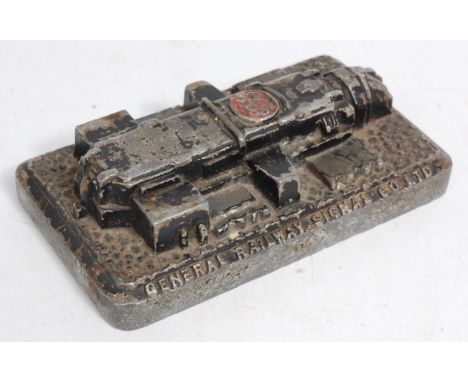 A railway advertising paperweight for GRS Ltd "General Railway Signal Co. Ltd" in the form of an engine block