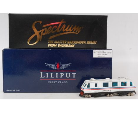 A Liliput Amtrak engineering vehicle (G), a Bachmann Spectrum self propelled ballast regulator (NM,BNM) and a similar Liliput