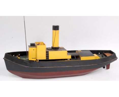 A scratch built live steam and remote control boat, comprising of horizontal vertical boiler, with single cylinder oscillatin