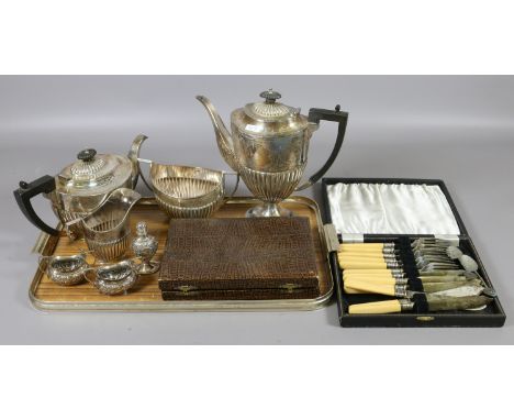 A tray lot of silver plate to include Edwardian four part tea service, cased cutlery and twin handled salts.
