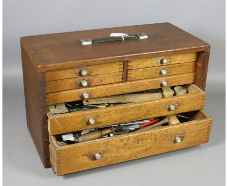 A Union chest of seven drawers and contents of horologistics/watch makers tools.