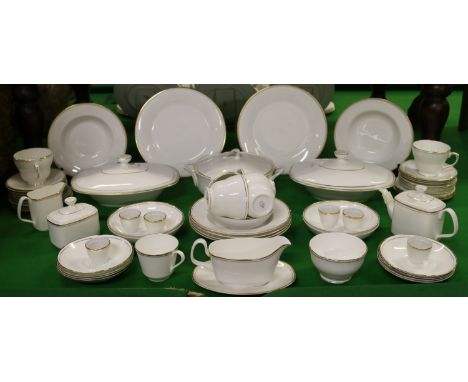 A Royal Doulton part tea/dinner service decorated in the gold Concord pattern approximately sixty pieces.