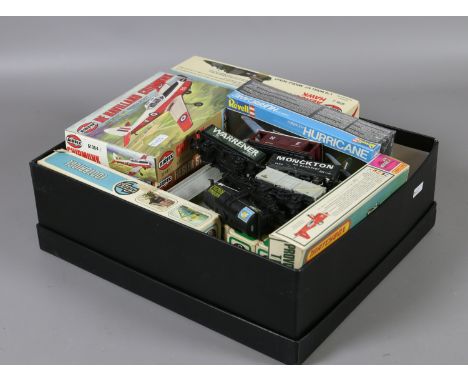 A collection of unused and boxed model construction kits to include Airfix examples, along with various oo gauge rolling stoc