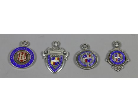 Four silver and enamel fobs, gross weight 62 grams.