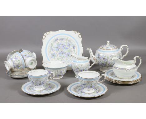 A Tuscan six place tea service decorated with flowers and gilt approximately twenty five pieces.
