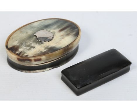 An early 19th century oval horn snuff box with silver shield shaped cartouche and another rectangular box. Oval box 9.25cm wi