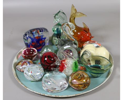 A collection of art glass and paperweights and a soap stone model of an elephant.