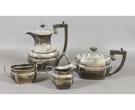 A silver four part tea service by Joseph Gloster Ltd assayed Birmingham 1965-66, 1588 grams.