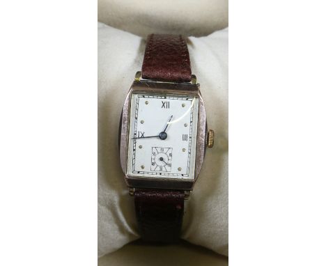 A vintage 9ct rose gold manual wristwatch with Roman numeral and spot markers, subsidiary seconds, hammered London 1942 in br